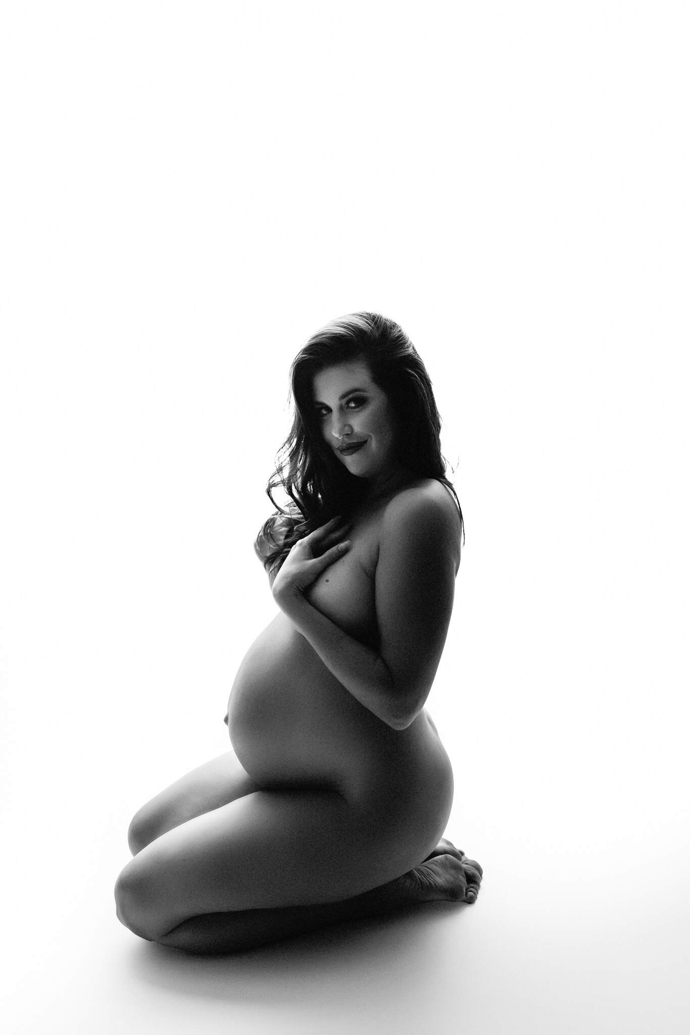 Fine art black and white backlit implied nudity at maternity photoshoot in Pennsylvania.