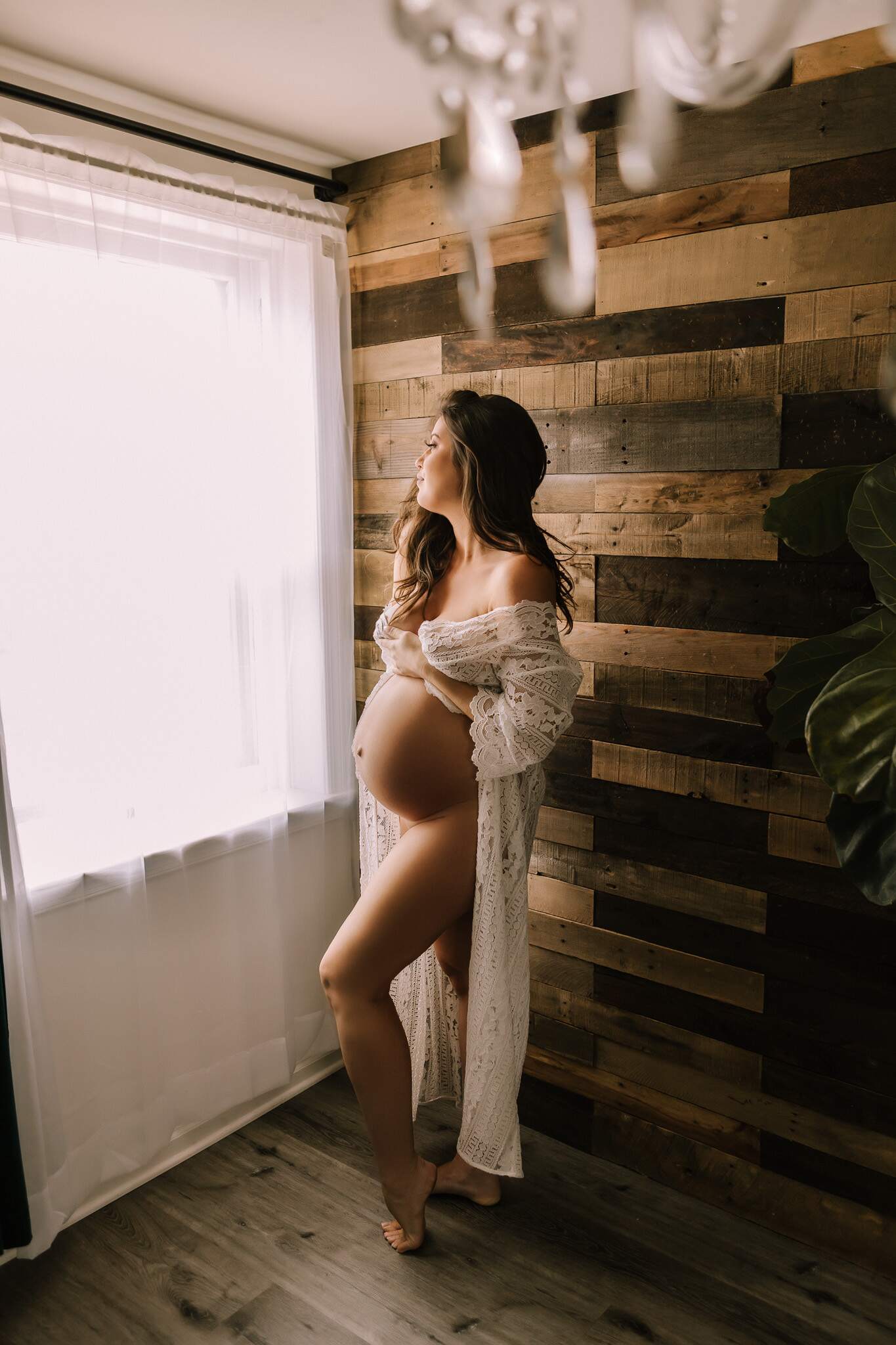 Fine art boudoir maternity in studio in Pennsylvania with white lingerie.