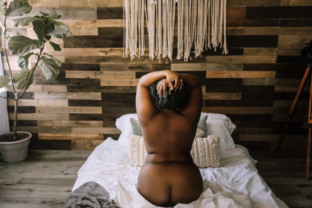 Partial nudity In studio classic beautiful black woman boudoir.